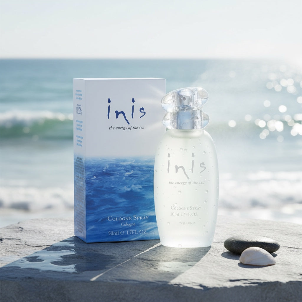 Inis Cologne Spray 50ml bottle and box resting on wet coastal rocks with sea and sky in background