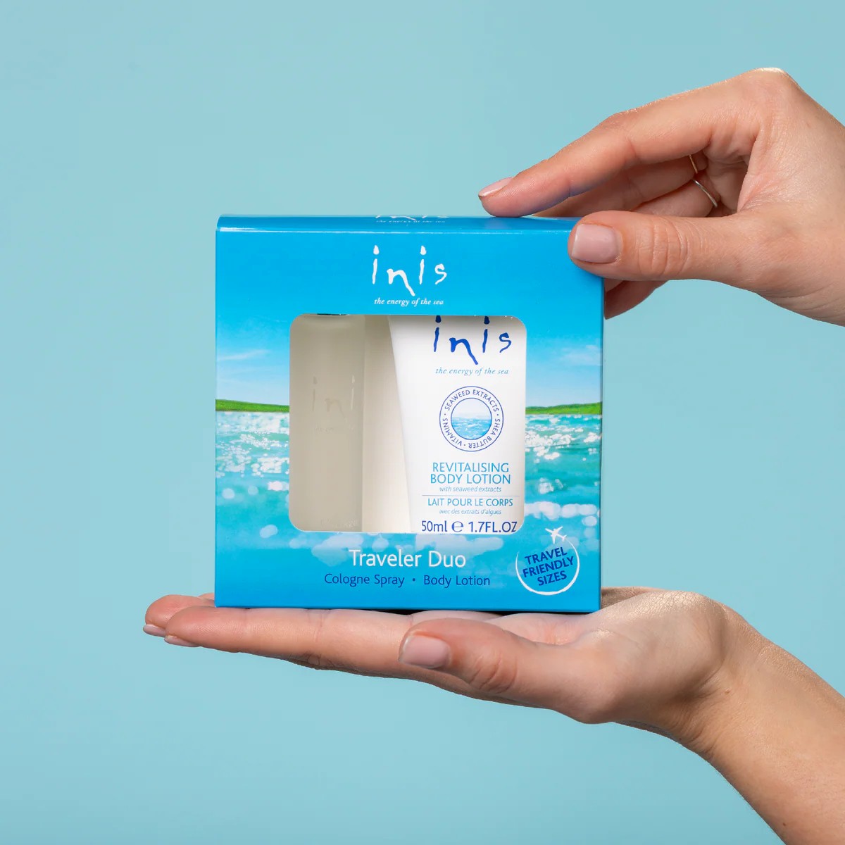 Hands holding the Inis Traveler Duo Set box